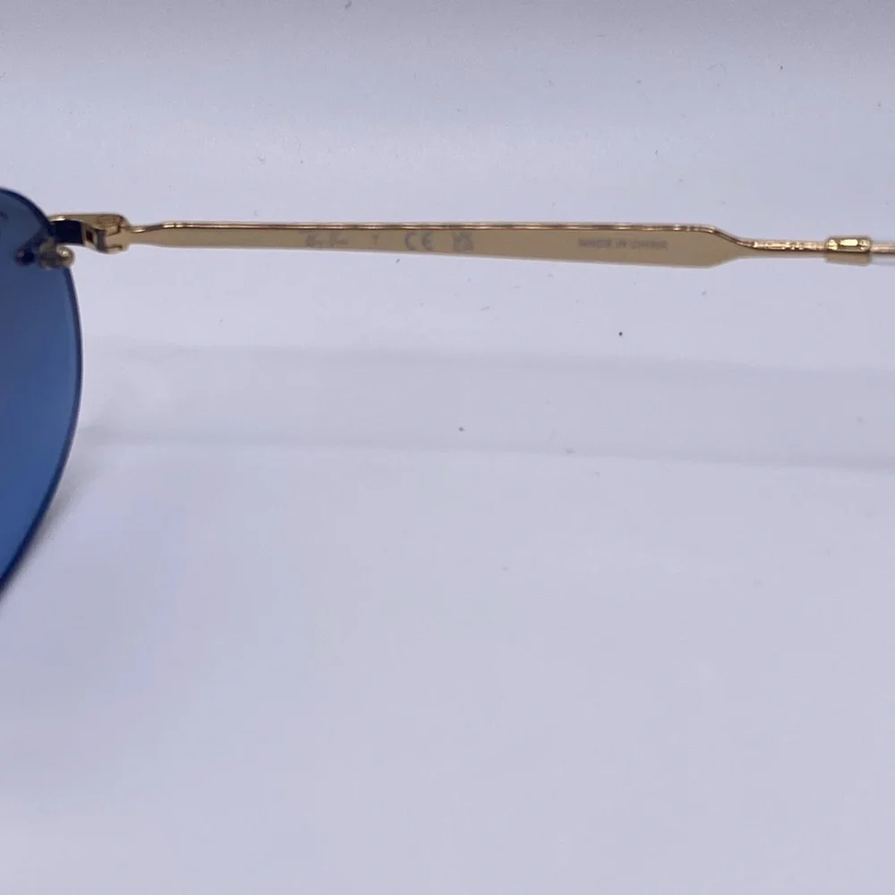 Ray-Ban Rimless Oval Sunglasses with Blue Lenses and Gold Temples